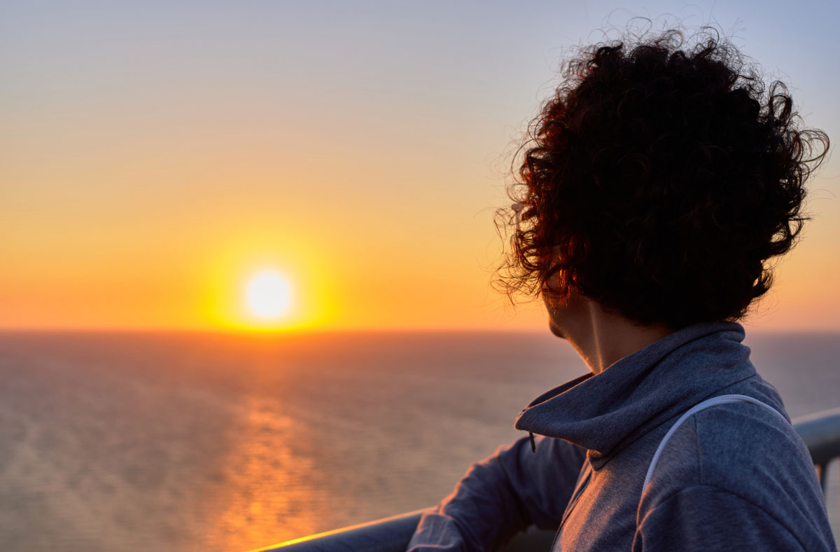 woman watching sunrise