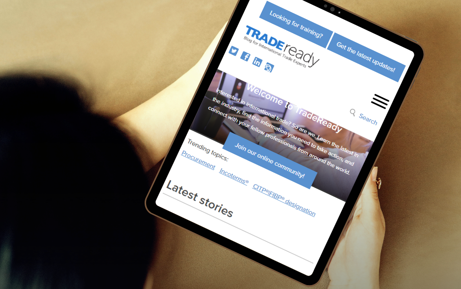 Person reading TradeReady articles on tablet