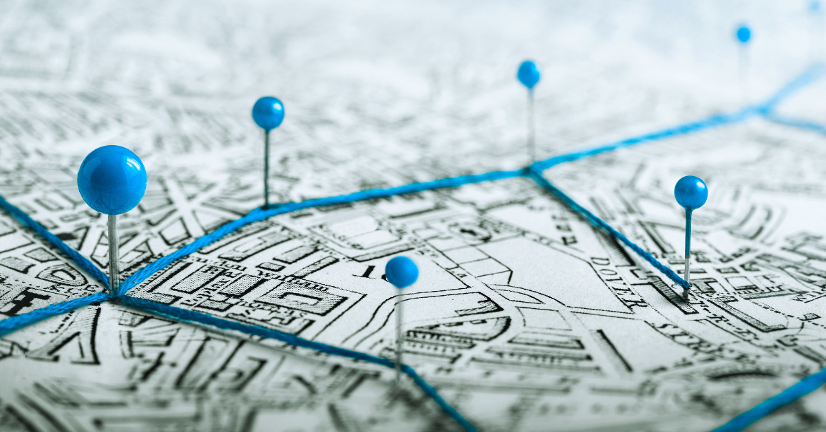 map route traced with blue string and pins