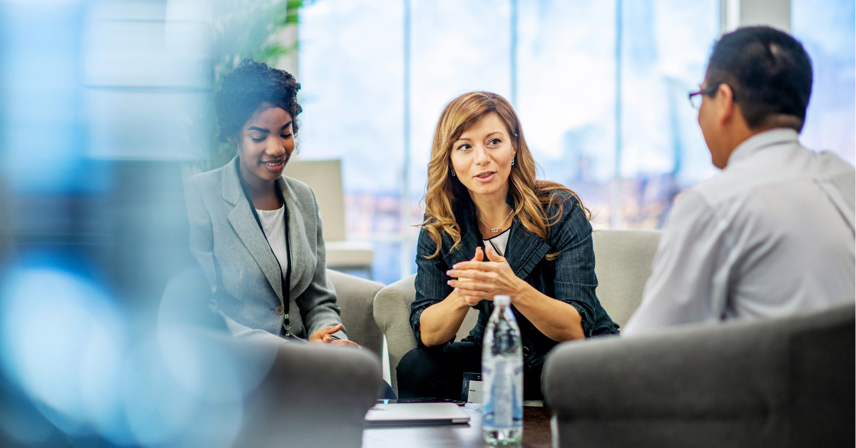 Group of professionals having a meeting around a coffee table